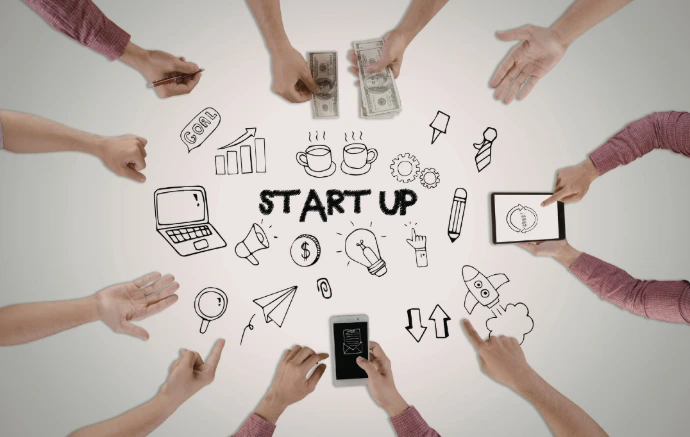 Team collaboration around a "Start Up" concept for new business ventures.